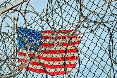 Flag through barbed wire Flag through barbed wire